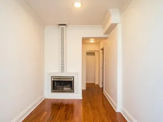Empire wall heater recessed in hallway